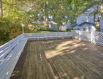 a large deck with a house in the background  at Edmonds Gateway, Edmonds, WA, 98026